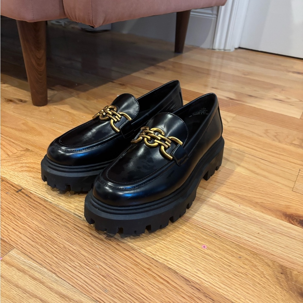 Black chunky loafers with chain detail